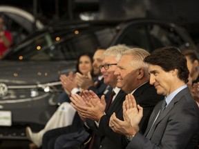 Prime Minister Justin Trudeau and Ontario Premier Doug Ford during an announcement on a Volkswagen electric vehicle battery plant at the Elgin County Railway Museum in St. Thomas, Ont.