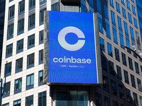 A monitor displays Coinbase signage during the company's initial public offering at the Nasdaq MarketSite in New York, U.S.