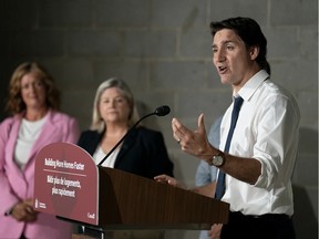 Prime Minister Justin Trudeau speaks during a visit to an apartment complex under construction in Hamilton, Ont.