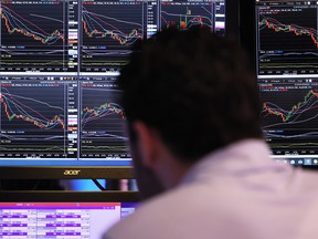 A trader works on the floor of the New York Stock Exchange.