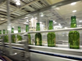 Bottles of Heineken NV brand beer on the production line of a Kirin Brewery Co. factory in Yokohama, Japan.