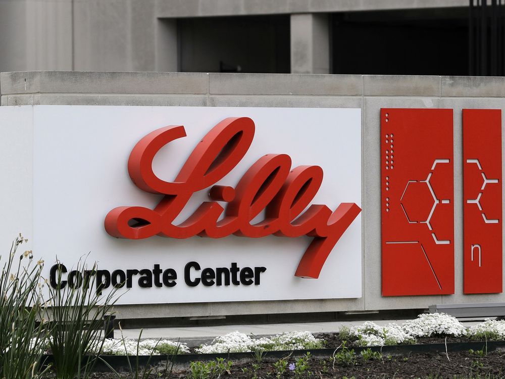 FILE - A sign for Eli Lilly & Co. sits outside their corporate headquarters in Indianapolis on April 26, 2017. New research shows another experimental Alzheimer's drug can modestly slow patients' inevitable worsening. Patients given monthly infusions of Eli Lilly and Co.'s donanemab declined about four to seven months more slowly than those given dummy infusions in a large study.