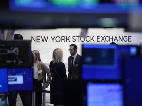 FILE - A sign is displayed on the floor of the New York Stock Exchange in New York, Wednesday, June 14, 2023.