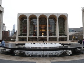 FILE - The Metropolitan Opera house, background center, appears at Lincoln Center in New York on March 12, 2020. Opera News, an 87-year-old publication focused on the Metropolitan Opera and spotlighting the art form in the U.S., will print its final issue in November and be incorporated into Britain-based Opera magazine.