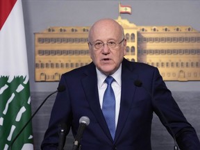 FILE - Lebanese caretaker Prime Minister Najib Mikati, speaks at the government palace, in Beirut, Lebanon, Monday, March 27, 2023. A three-year probe against Lebanon's caretaker prime minister and his family over corruption allegations has been closed by Monaco's judicial authorities for lack of evidence, the premier's office said Friday, Aug. 25.