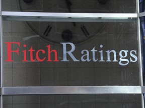 FILE - This photo shows signage for Fitch Ratings, Sunday, Oct. 9, 2011, in New York. On Tuesday, Aug. 1, 2023, Fitch Ratings has downgraded the U.S. credit rating, citing an expected increase in government debt over the next three years and a