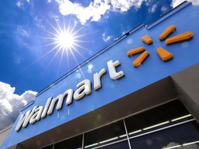 FILE - The entrance to a Walmart store is shown on June 25, 2019 in Pittsburgh. Walmart reports earning on Thursday.
