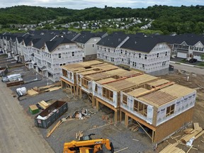 File - Townhomes under construction are shown in Mars, Pa., on May, 27, 2022. On Thursday, Freddie Mac reports on this week's average U.S. mortgage rates.