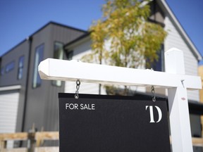A sign stands outside a new home for sale Monday, Aug. 21, 2023, in southeast Denver. On Thursday, Freddie Mac reports on this week's average U.S. mortgage rates.