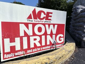 A hiring sign is displayed outside of a hardware store in Buffalo Grove, Ill., Sunday, July 9, 2023. On Thursday, the Labor Department reports on the number of people who applied for unemployment benefits last week.