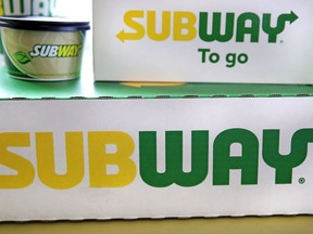 File - The Subway logo is seen on takeout boxes at a restaurant in Londonderry, N.H., on Feb. 23, 2018. The sandwich chain said Thursday it will be sold to the private equity firm Roark Capital. Terms of the deal weren't disclosed.