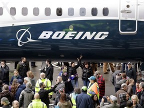 FILE- In this Feb. 5, 2018, file photo a Boeing 737 MAX 7 is displayed during a debut for employees and media of the new jet in Renton, Wash. U.S. regulators are warning airlines to limit the use of an anti-icing system on Boeing 737 Max jets in dry air to avoid overheating engine-housing parts, which could cause them to break away from the plane.