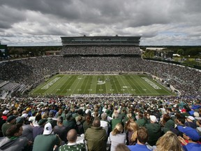 FILE - Michigan State and Air Force play an NCAA college football game, Saturday, Sept. 19, 2015, in Spartan Stadium in East Lansing, Mich. Michigan State University plans to sell alcohol at select home football games in the 2023 season following a recent change to state law that permits liquor licenses to be issued to sporting venues at public universities.