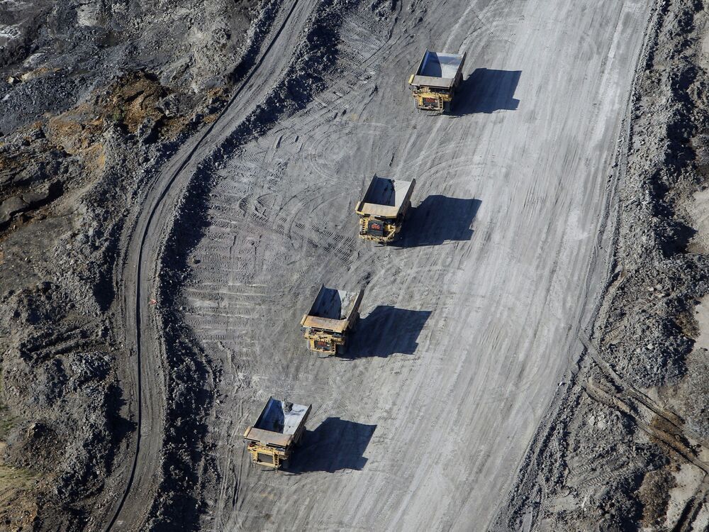 Dump trucks loaded with oilsands drive through the Suncor Energy Inc. mine in Alberta. If oil prices are higher in the months to come, something that is quite possible, where will the large drops in inflation come from?