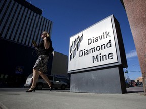 A pedestrian walks in front of the Diavik Diamond Mine offices in Yellowknife, Northwest Territories.