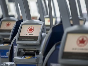 An Air Canada ticketing station is shown at Pearson International Airport in Toronto on Wednesday, April 8, 2020.&ampnbsp;Air Canada says earnings reached heights not seen since before the COVID-19 pandemic amid high travel demand and pricier fares, and despite low on-time performance numbers. THE&ampnbsp;CANADIAN PRESS/Nathan Denette