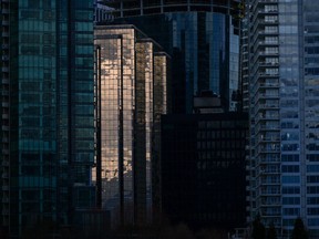 Condo and office towers are seen in downtown Vancouver, on Tuesday, April 25, 2023. A new report by Colliers Canada predicts the national office vacancy rate could peak at approximately 15 per cent by the end of 2024 as the rise of hybrid work models prompt companies to reduce their office space.THE CANADIAN PRESS/Darryl Dyck
