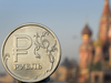 Ruble against backdrop of St. Basil's in Moscow