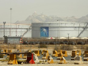 FILE - Storage tanks are seen at the North Jiddah bulk plant, an Aramco oil facility, in Jiddah, Saudi Arabia, on March 21, 2021. Saudi Arabia's state-run oil giant Aramcobrought in $30 billion in revenues in the second quarter of 2023, a nearly 40% decline from the same period the previous year, which it attributed to lower crude oil prices.