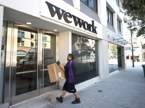 A FedEx driver makes a delivery to a WeWork office in California. The co-working office space company is facing financial troubles, but that doesn't mean flexible work is dead.