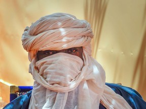Boubacar Moussa, a former member of the Islamic State group, poses for a photograph in Niamey, Niger, Tuesday, Aug. 1, 2023. The 47-year-old says Niger's coup will embolden violence, increase recruitment across the country and threaten regional stability.