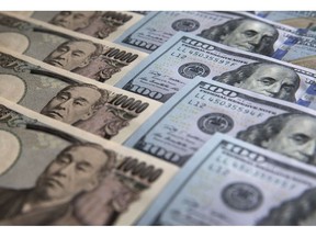 Japanese yen and US dollars Photographer: Tomohiro Ohsumi/Bloomberg