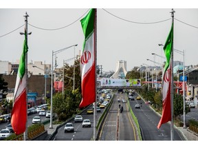 National flags of Iran fly above Azadi avenue in Tehran, Iran.in Tehran, Iran, on Saturday, Nov. 3, 2018. Iran's Supreme Leader Ayatollah Khamenei said U.S. President Donald Trump's policies are opposed by most governments and fresh sanctions on the Islamic Republic only serve to make it more productive and self-sufficient, the semi-official Iranian Students' News Agency reported. Photographer: Ali Mohammadi/Bloomberg