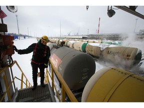 A worker oversees the loading of rail transport wagons with gasoline at the Taneco Oil Refining and Petrochemical complex, operated by Tatneft PJSC, in Nizhnekamsk, Tatarstan, Russia, on Tuesday, March 5, 2019. Tatneft explores for, produces, refines, and markets crude oil.