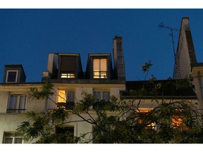 Lights emerge from residential homes in Paris, France, on Thursday, July 28, 2022. Second Sentence. Photographer: Benjamin Girette/Bloomberg