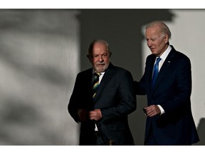 US President Joe Biden, right, and Luiz Inacio Lula da Silva, Brazil's president, walk through the Colonnade of the White House in Washington, DC, US, on Friday, Feb. 10, 2023. Biden is hosting Lula in a show of support for Brazilian democracy, shaken last month by a right-wing insurrection akin to the invasion of theUS Capitol in 2021.