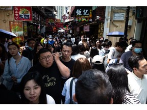 Tourists in in Macau for the five-day holiday in April. Photographer: Eduardo Leal/Bloomberg
