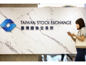 Signage at the Taiwan Stock Exchange Corp. headquarters in Taipei, Taiwan, on Monday, July 10, 2023. The Taiwan Stock Exchange, National Development Council and Environmental Protection Administration are planning to establish a carbon-trading platform in an effort to achieve CO2-reduction goals, President Tsai Ing-wen said earlier. Photographer: I-Hwa Cheng/Bloomberg