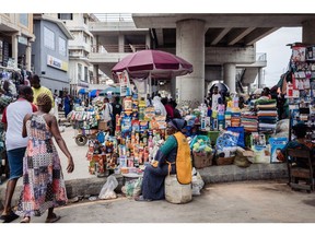A trader displays her wares at Yaba market in Lagos, Nigeria, on Monday, July 17, 2023. Nigeria's monthly inflation rate soared to a seven-year high in June, after President Bola Tinubu scrapped fuel subsidies and allowed the currency to weaken before declaring a state of emergency to control staple food costs.
