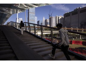 Pedestrians in Shenzhen, China, on Wednesday, Aug. 9, 2023. China's economic recovery is being weighed down by a worsening property slump, with the latest data likely to show little sign of a rebound in growth. Photographer: Qilai Shen/Bloomberg