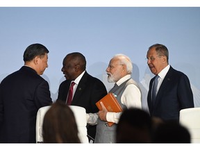 The leaders of China, South Africa, Russia and India meet on the closing day of the BRICS summit in Johannesburg.