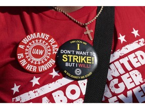 A United Auto Workers (UAW) supporter during a Labor Day parade in Detroit, Michigan, US, on Monday, Sept. 4, 2023. The UAW's 150,000 members are threatening a strike on General Motors, Ford Motor Co. and Stellantis NV, maker of the Jeep and Chrysler brands, if a deal with Detroit's big three legacy carmakers is not reached by a September 14 deadline.
