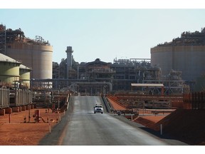 A car travels through the Gorgon liquefied natural gas (LNG) and carbon capture and storage (CCS) facility, operated by Chevron Corp., at Barrow Island, Australia, on Monday, July 24, 2023. Chevron received approval to develop the site into a major liquefied natural gas export facility on the basis they could capture and store 80% of the CO2 mixed in with the fuel, instead of releasing it. Photographer: Lisa Maree Williams/Bloomberg
