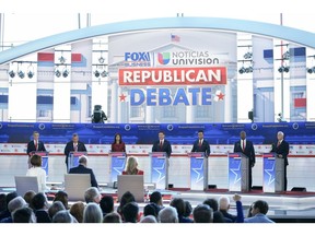 2024 Republican presidential candidates Doug Burgum, from left, Chris Christie, Nikki Haley, Ron DeSantis, Vivek Ramaswamy, Senator Tim Scott and former US Vice President Mike Pence during the Republican primary presidential debate hosted by Fox Business Network in Simi Valley, California, US, on Wednesday, Sept. 27, 2023. The auto workers strike, the looming government shutdown and a renewed focus on abortion rights all set the backdrop for the second Republican primary debate today.