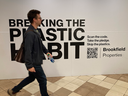 A Brookfield billboard in an underground passage mall in Toronto calls on subway passengers to join in “Breaking the plastic habit.”