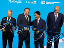 Quebec Premier Francois Legault, centre, is flanked by François-Philippe Champagne, left, minister of innovation, science and Industry Canada, Dejae Chin, right, chairman of Volta Energy Solutions, and Pierre Fitzgibbon, far right, minister of Economy, Innovation and Energy, as they announced a deal Sept. 5, 2023, to build a plant in Granby, Que., to supply components for EV batteries.