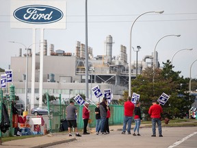 At the moment's information: Massive grocers agree to search out methods to decrease meals costs Categorical Instances 7 United Auto Workers members strike at the Ford Michigan Assembly Plant over the weekend in in Wayne, Michigan.