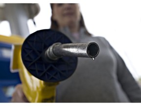 UNITED STATES - MAY 15: A drop of E85, a mixture of 85 percent ethanol and gasoline, hangs at the end of a gas pump held for a photograph by Katie Hitt at a Mobil station in Birmingham, Michigan, U.S., on Thursday, May 15, 2008. Prices for wheat, corn and soybeans have climbed to records, partly on demand for the grains to make fuels such as ethanol as an alternative to crude oil.
