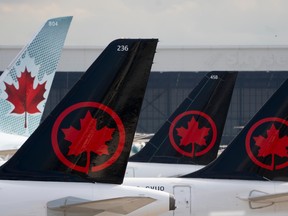 Air Canada logos are seen on the tails of planes in Montreal.