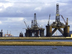 FILE - North sea oil exploration platforms lie in the Cromerty Firth in northern Scotland on March 2, 2003. British regulators on Wednesday, Sept. 27, 2023, approved new oil and gas drilling in the North Sea, a move environmentalists say will hurt the country's attempt to meet its climate goals.
