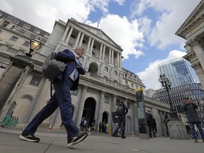 FILE - A man walks past the Bank of England, at the financial district in London, on May 11, 2023. Homeowners across the U.K. are hoping that the Bank of England will decide to avoid raising interest rates for the first time in nearly two years. Following news that inflation fell unexpectedly in August to its lowest level since Russia invaded Ukraine, expectations have grown that the central bank will opt Thursday, Sept. 21, 2023, to keep its main interest rate unchanged.