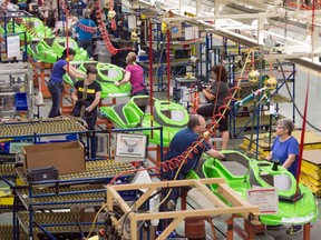 Employees work on the Sea-Doo assembly line at the Bombardier Recreational Products plant in 2014 in Valcourt, Que.