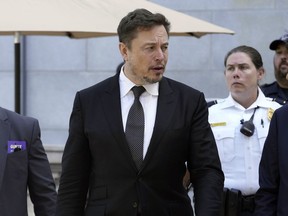 Elon Musk, CEO of X, the company formerly known as Twitter, departs from a closed-door gathering of leading tech CEOs to discuss the priorities and risks surrounding artificial intelligence and how it should be regulated, at Capitol Hill in Washington, Wednesday, Sept. 13, 2023.
