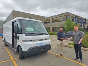 Ecom Logistics CEO Luqman Ahmed receiving delivery of Brightdrop electric vans
