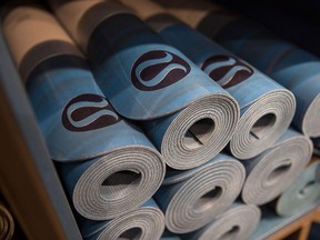 Yoga mats sit on display at the Lululemon Athletica store in London.