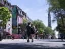 A couple strolls down St-Denis Street in Montreal.